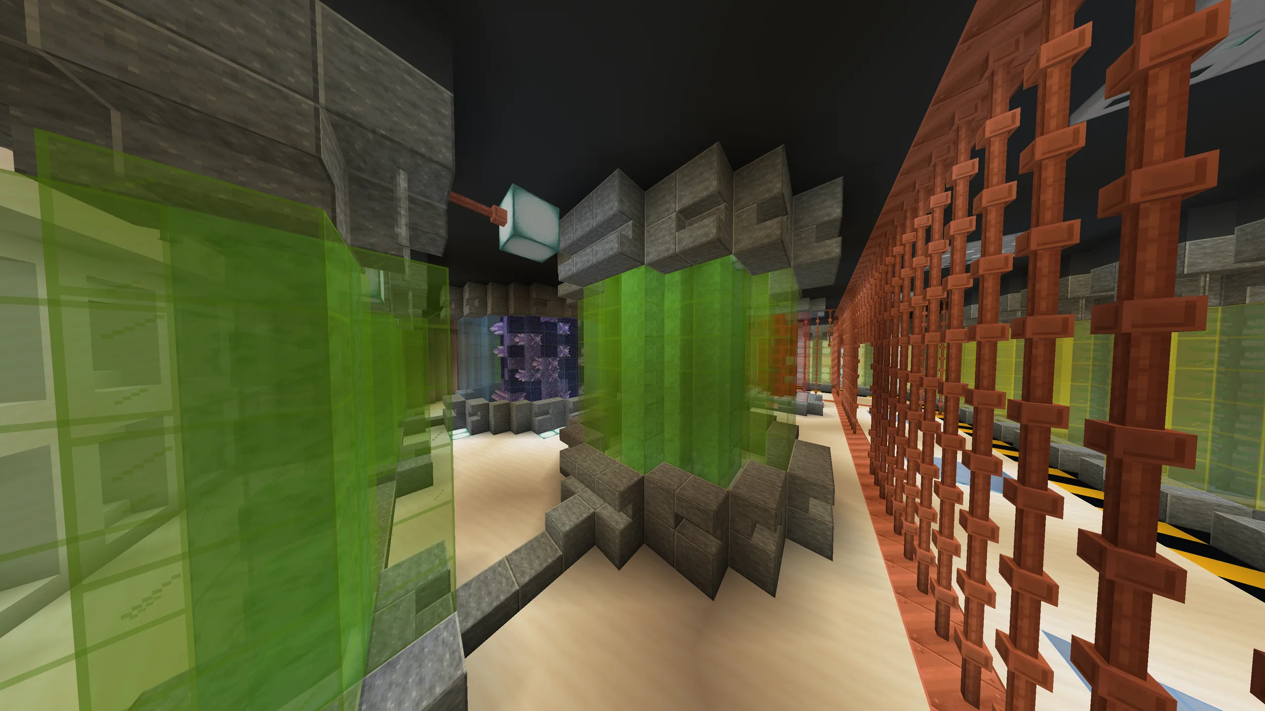 A lab corridor with green glass tanks